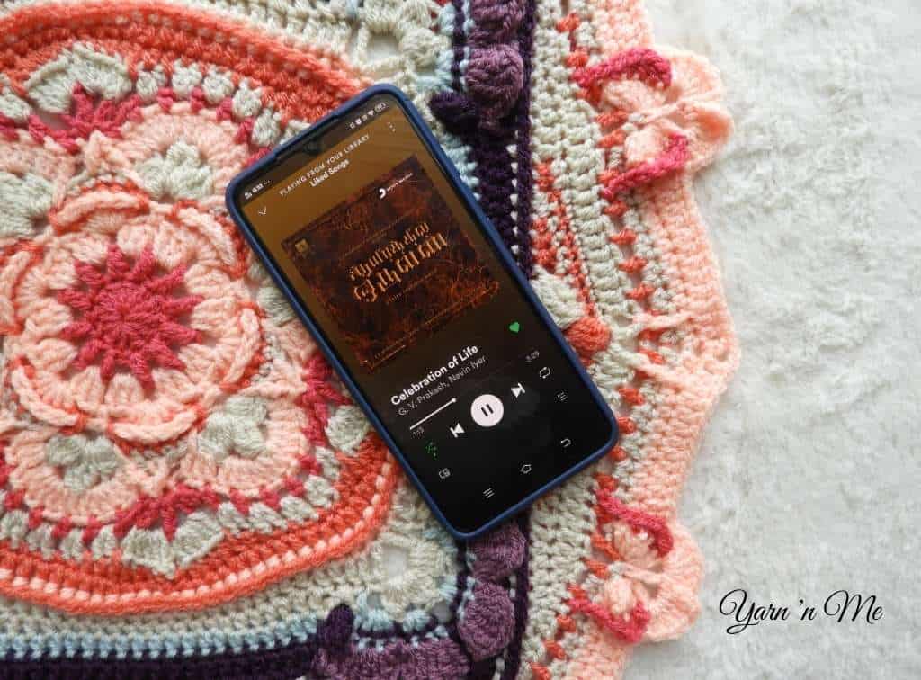 Listen to music while crocheting to break the monotony